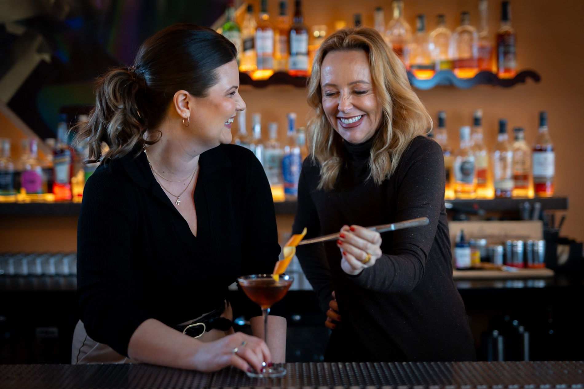 Female bartenders Kaitlin Wilkes and Kristine Bochino